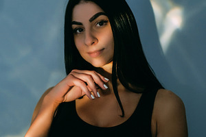 Dark light model pretty woman face posing flare, a Person Photo by Photo Drive Studio