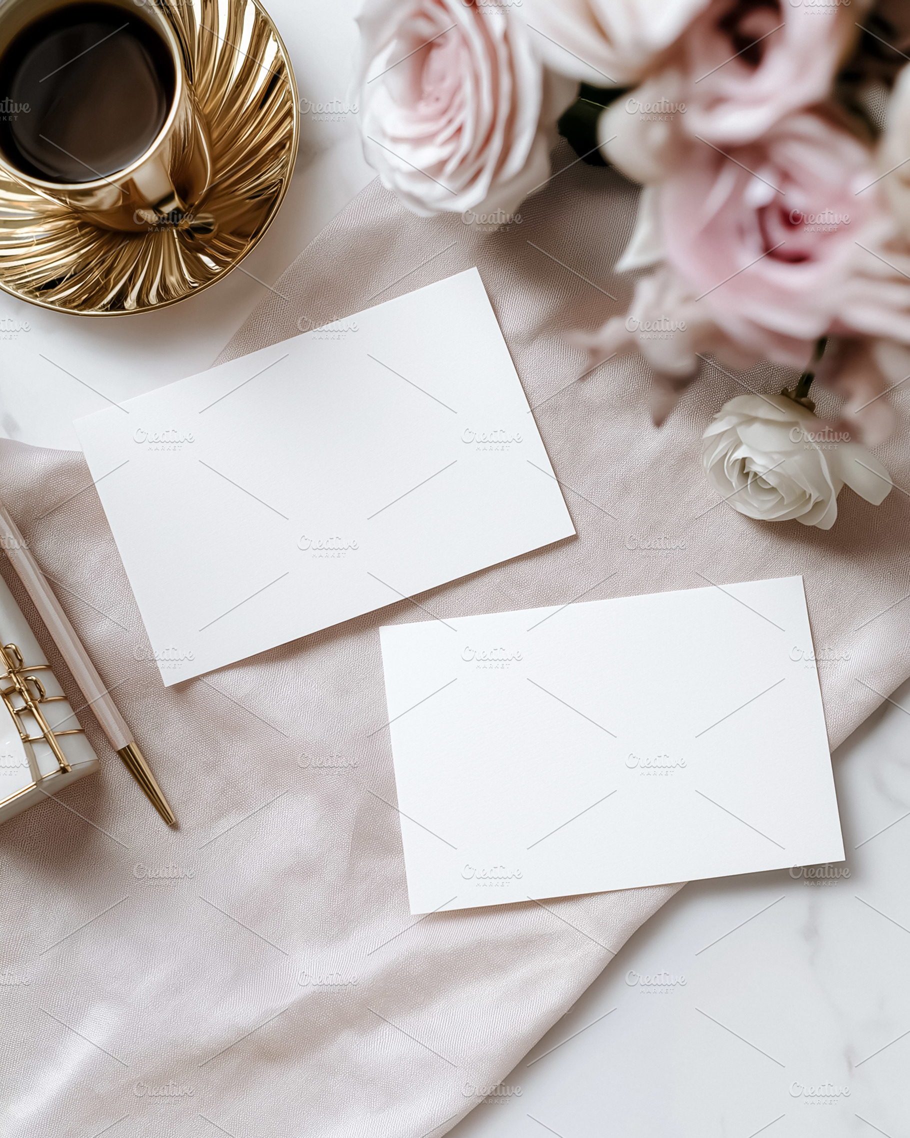 Two blank white cards mockup on elegant light pink fabric with roses, coffee, a, a Holiday Photo by Studio ANNA