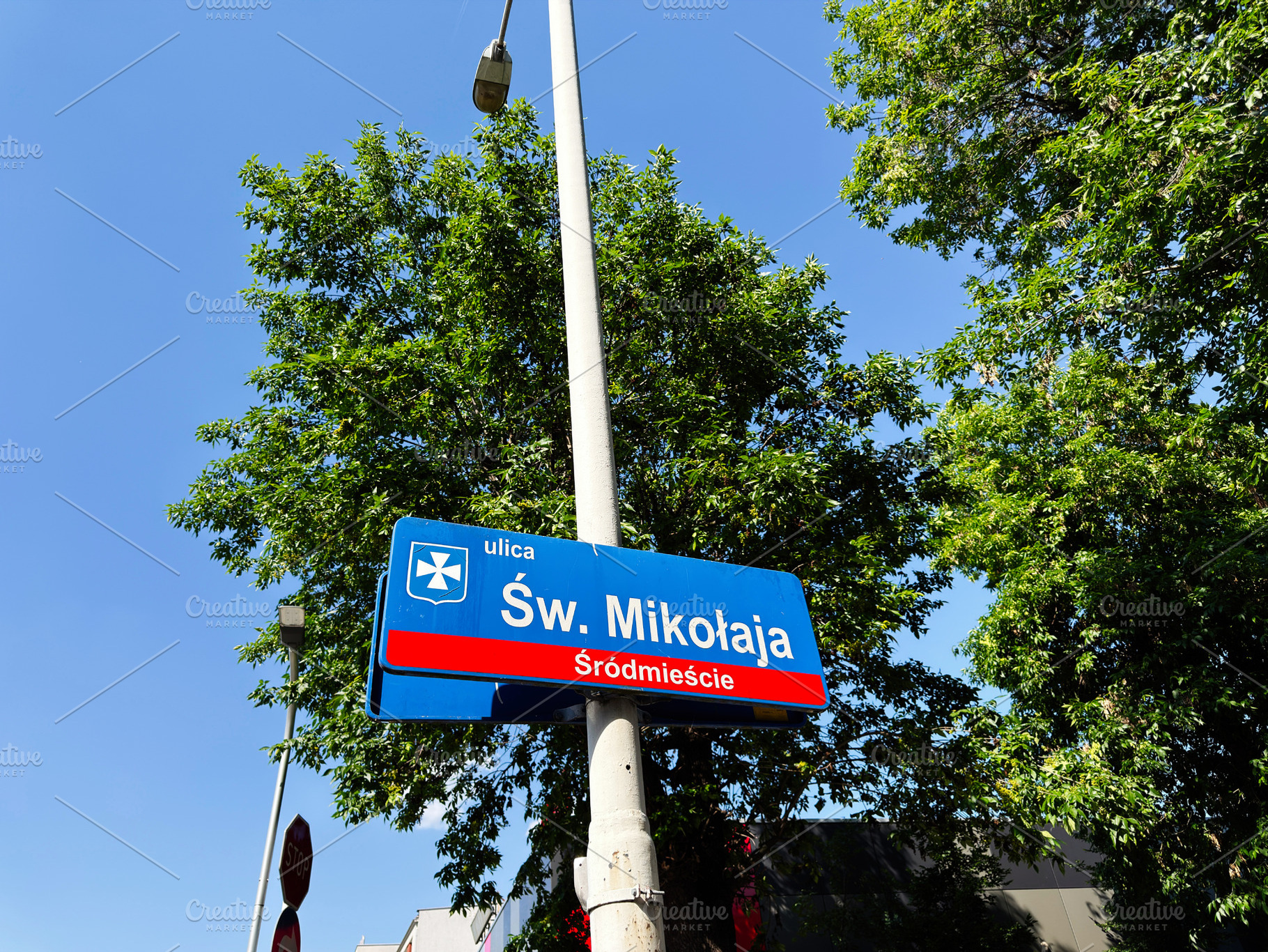 Street sign for Św. Mikołaja in Rzeszow Poland with blue sky a, a Photo by AS photostudio