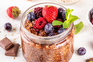 Chocolate Overnight Oatmeal, with chocolate sauce, nuts and fres, a Food & Drink Photo by Rimma