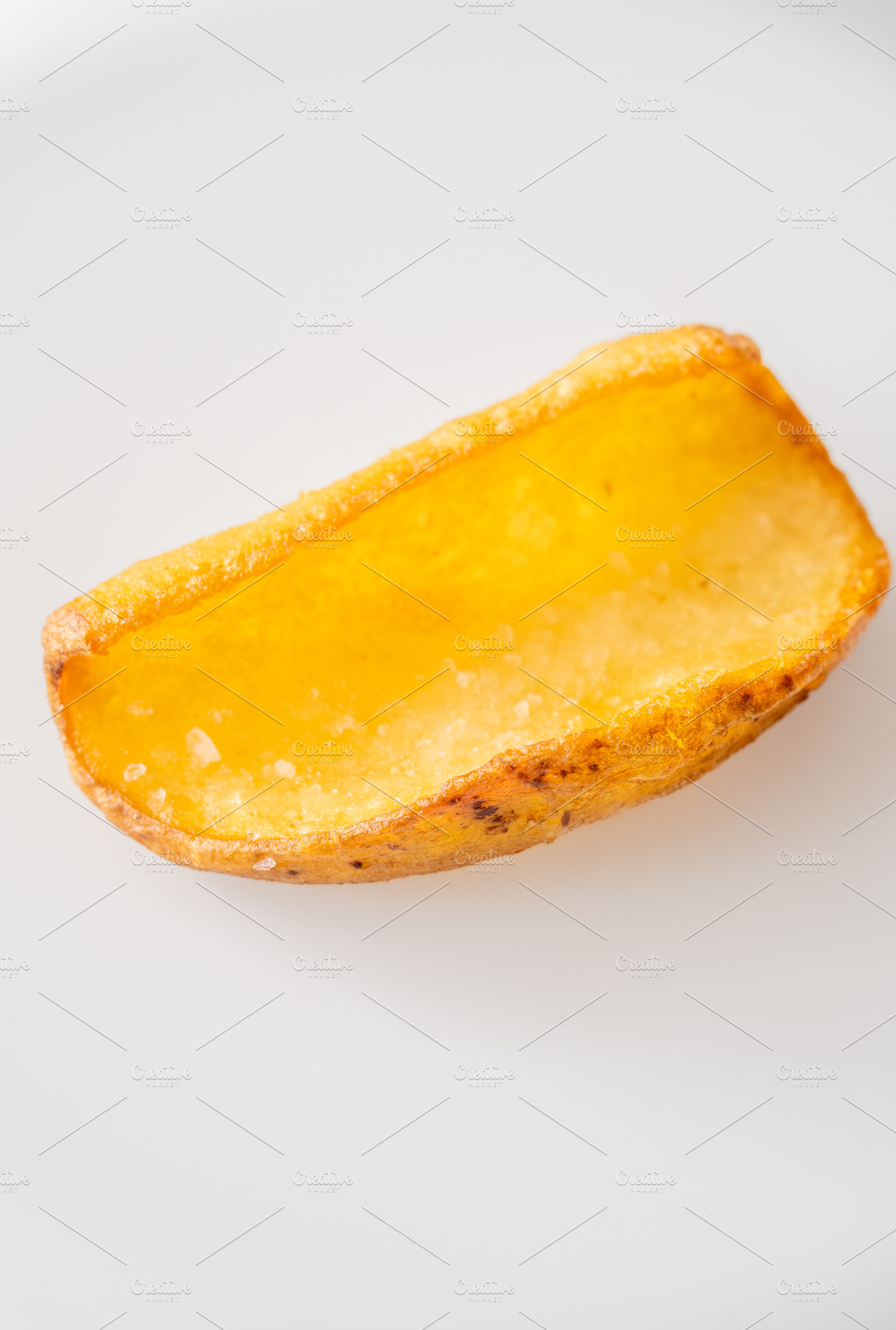 Single crispy potato dipper isolated, a Food & Drink Photo by Alexander Prokopenko