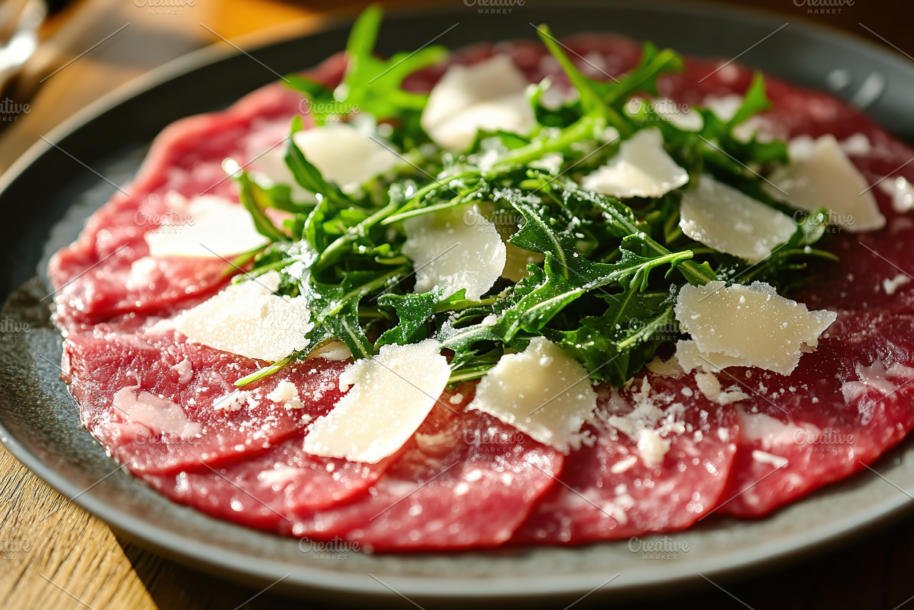 Fresh beef carpaccio topped with arugula and shaved cheese on a rustic wooden t, a Food & Drink Photo by AlyaAnd
