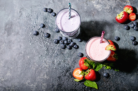 Fresh strawberry and blueberry milks featuring strawberry, milk, and juice