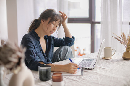 Attractive Asian woman remote working from home distance office on laptop, taki, a Person Photo by Anikona