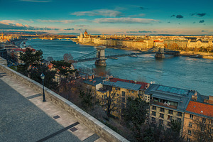 Bridge and waterfront buildings, an Architecture Photo by Alpine Dreams