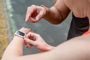 Runner Checking Smartwatch During Outdoor Workout, a Sports & Recreation Photo by etorres69