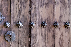 Old wooden door with metal studs, an Architecture Photo by DanFLCreativo