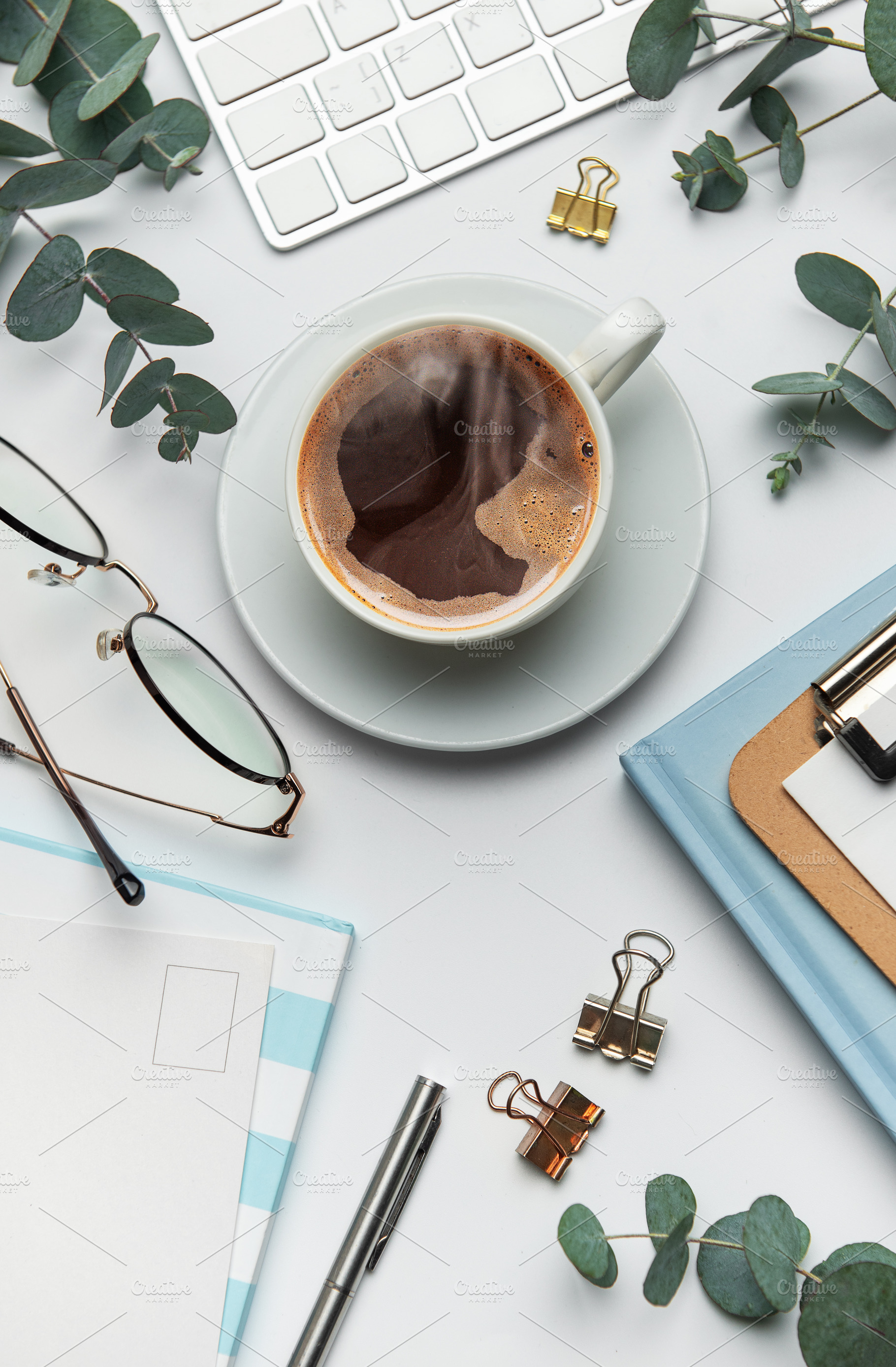 Eucalyptus, coffee cup, keyboard and stationery creating relaxin, a Business Photo by Olena Rudo