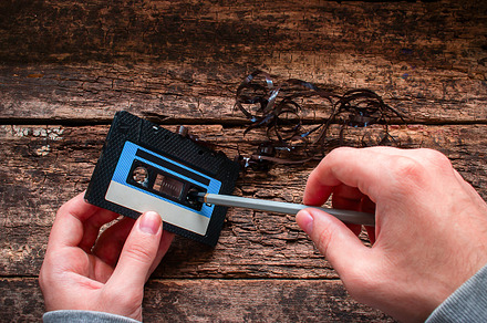 man rewind a cassette tape, a Technology Photo by itakdalee