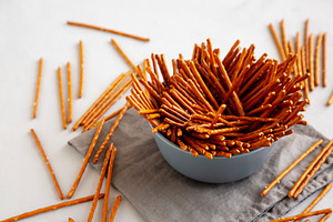Organic Salty Pretzel Sticks in a Bowl, side view., a Food & Drink Photo by LiudmylaChuhunova