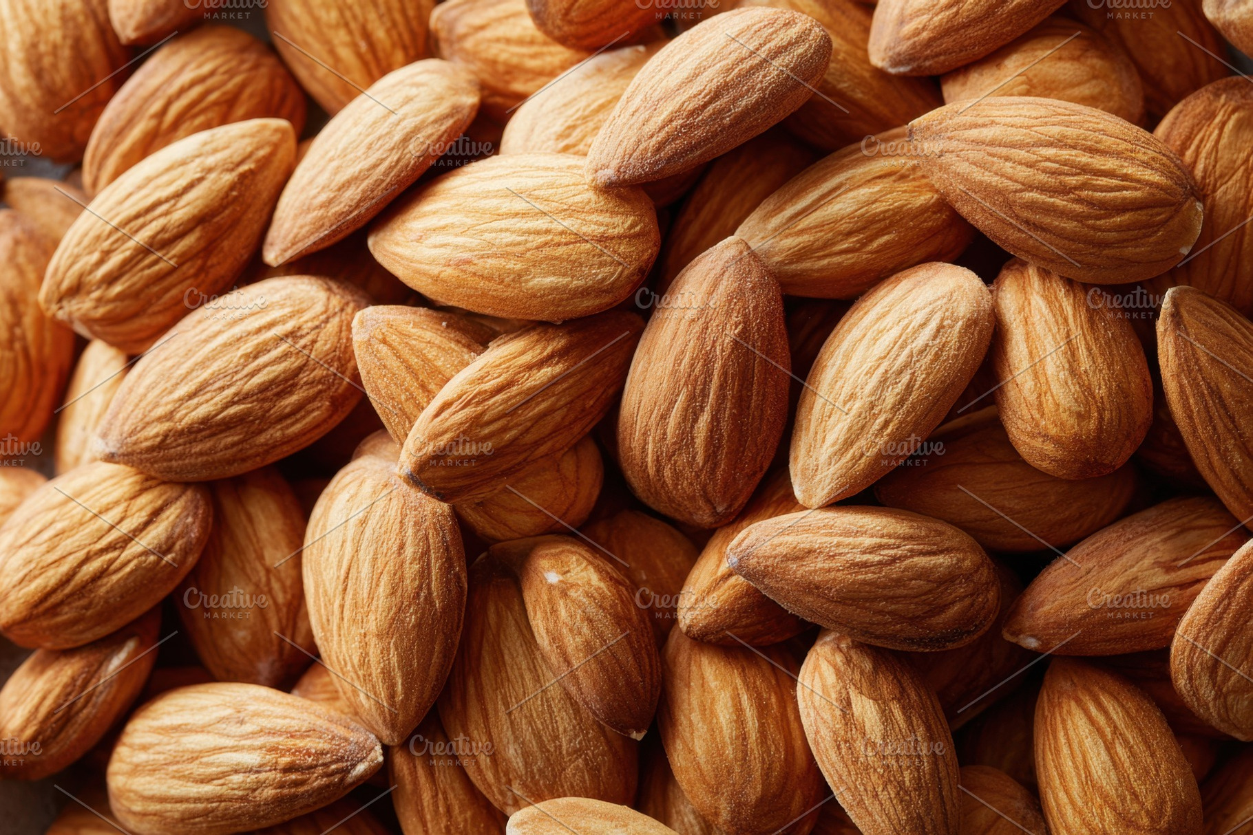 Background of roasted almonds nuts, a Food & Drink Photo by AlyaAnd