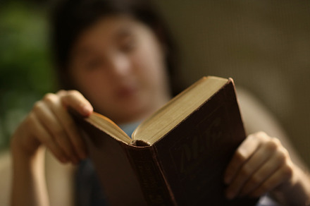 Teenager boy reading in hammock stock photo containing girl and book