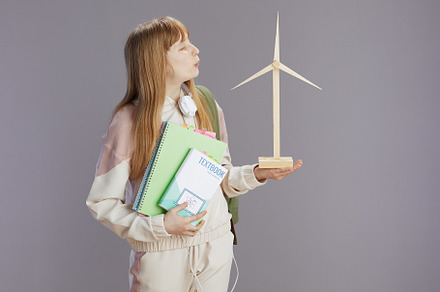 trendy teenage girl in beige tracksuit with workbooks, a School & Education Photo by Alliance Images