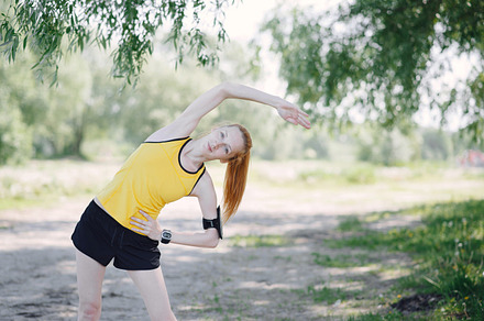 Woman runner stretching body containing fitness, sports, and run, a Sports & Recreation Photo by Booblgum