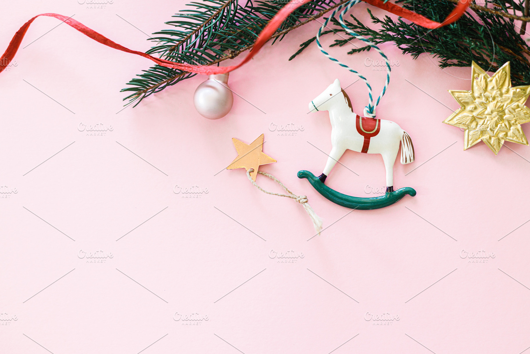 Stylish christmas horse toy flat lay on pink background with gol, a Holiday Photo by Sonjachni