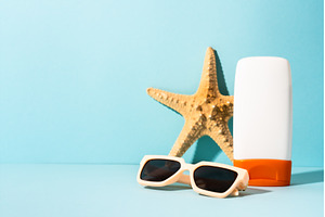Sunglasses, sunscreen and sea shell, a Nature Photo by Nadia-nb