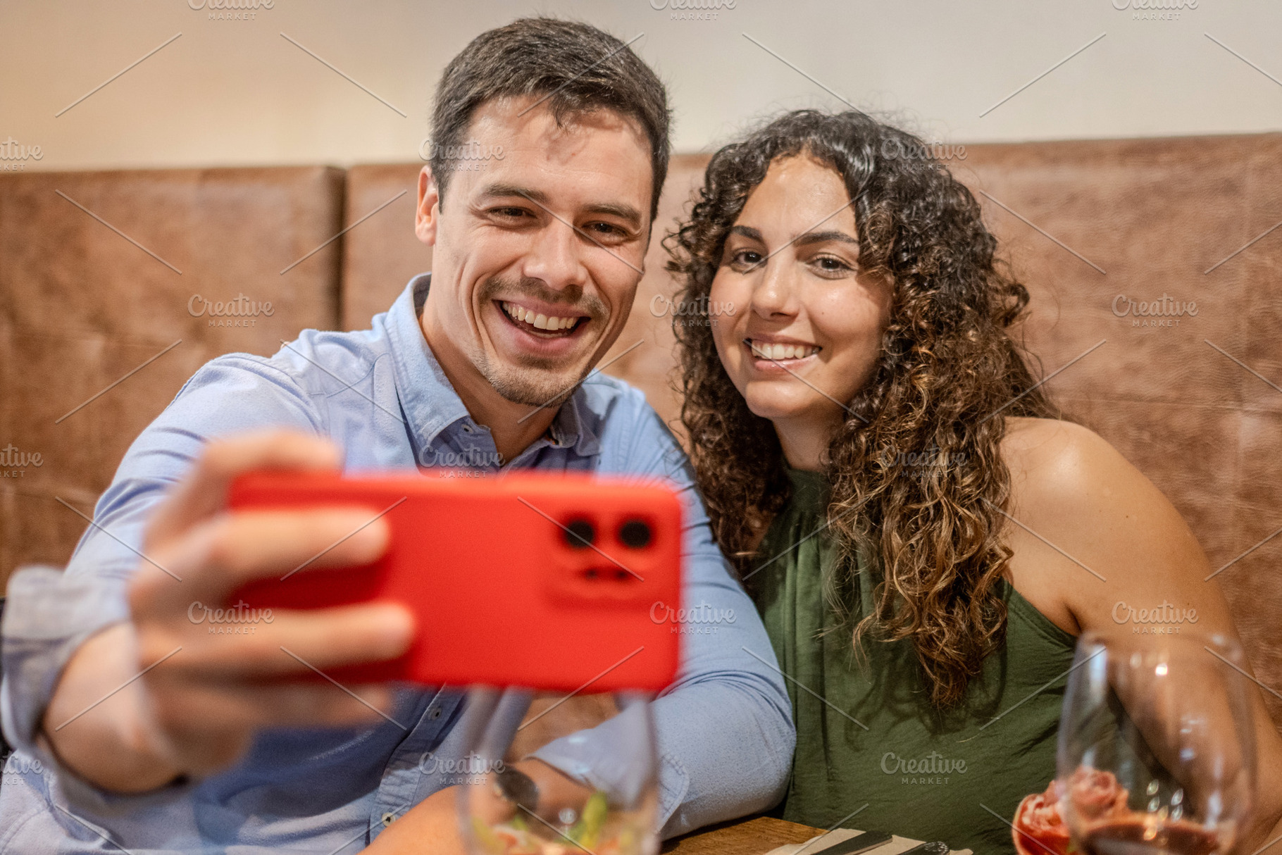Happy Couple Taking a Selfie While Dining at a Restaurant, a Person Photo by etorres69