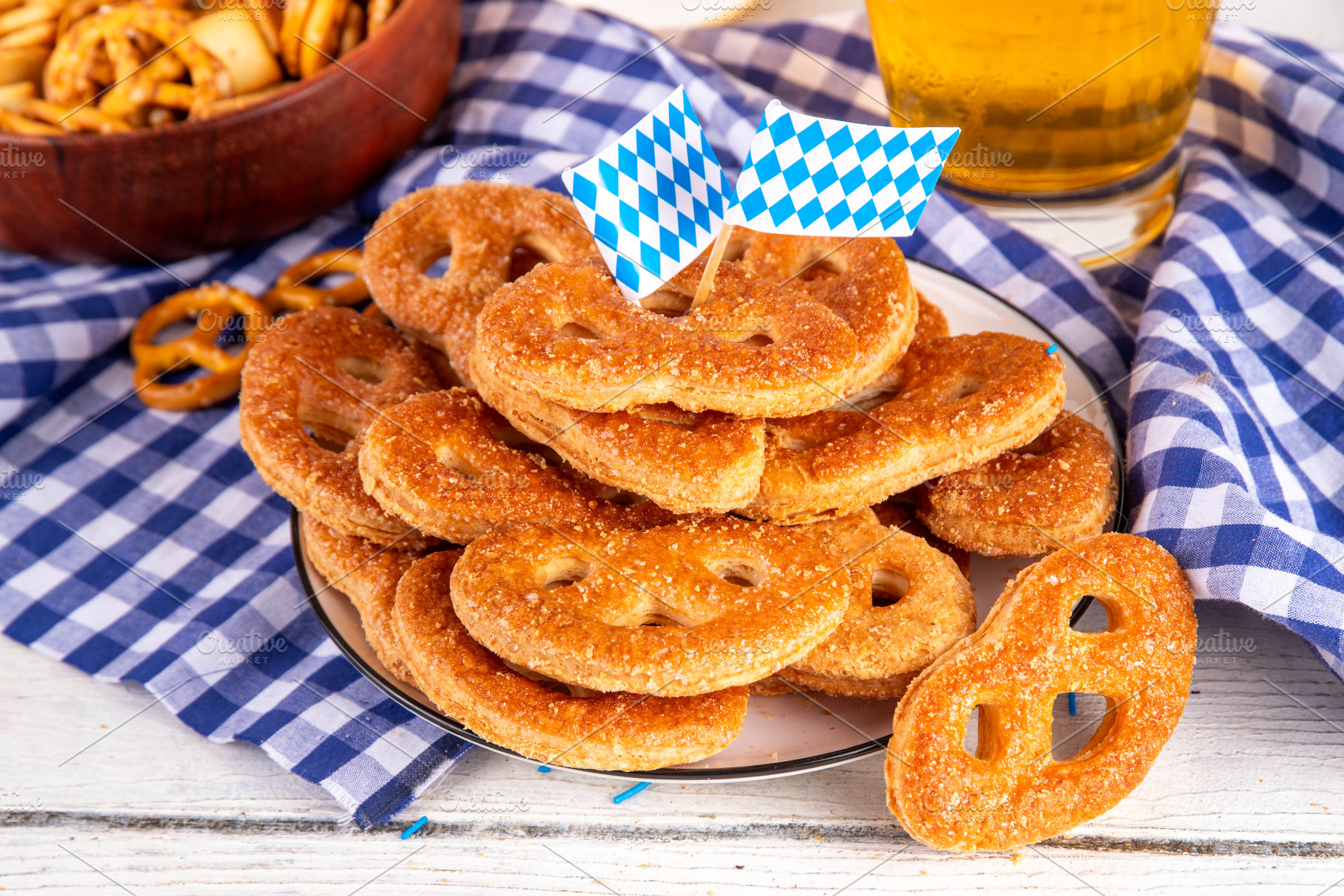 Sweet sugary pretzel cookies on Oktoberfest decorated background, a Food & Drink Photo by Rimma