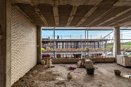 Bricks on scaffolding ready to be placed in construction site, an Industrial Photo by Architect´s eye