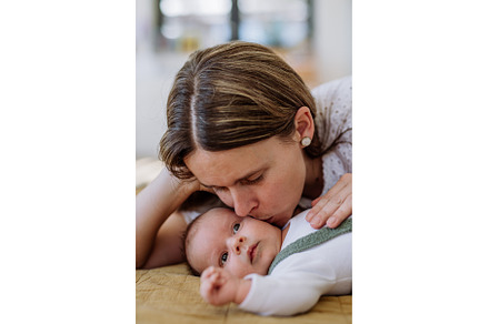 Portrait of mother kissing her, a Person Photo by HalfPoint