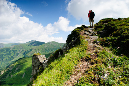 Treveller hiking stock photo containing mountains and nature, a Nature Photo by oksix