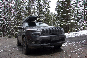 Dirty Jeep Cherokee in Forest