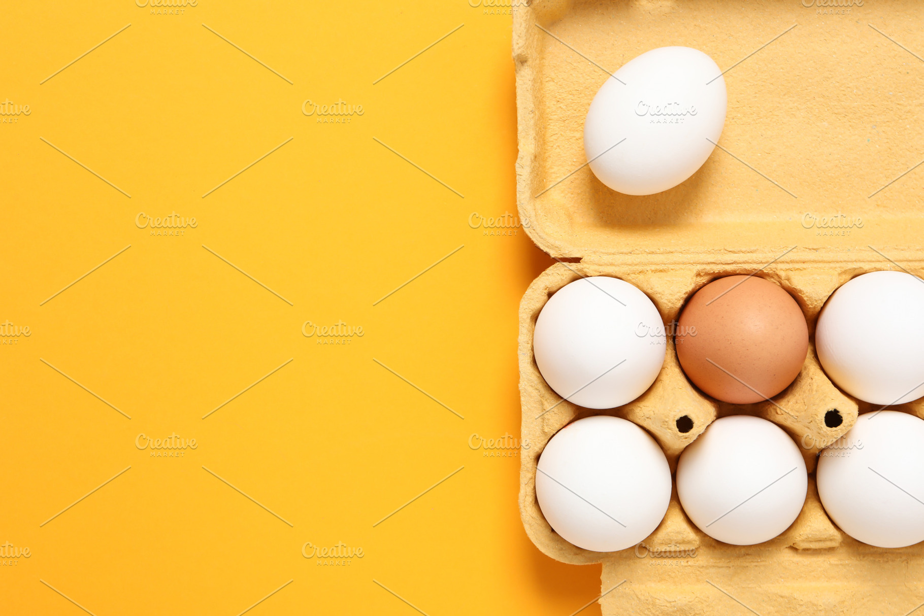 Egg box with eggs, space for text, a Food & Drink Photo by AtlasStudio PRO