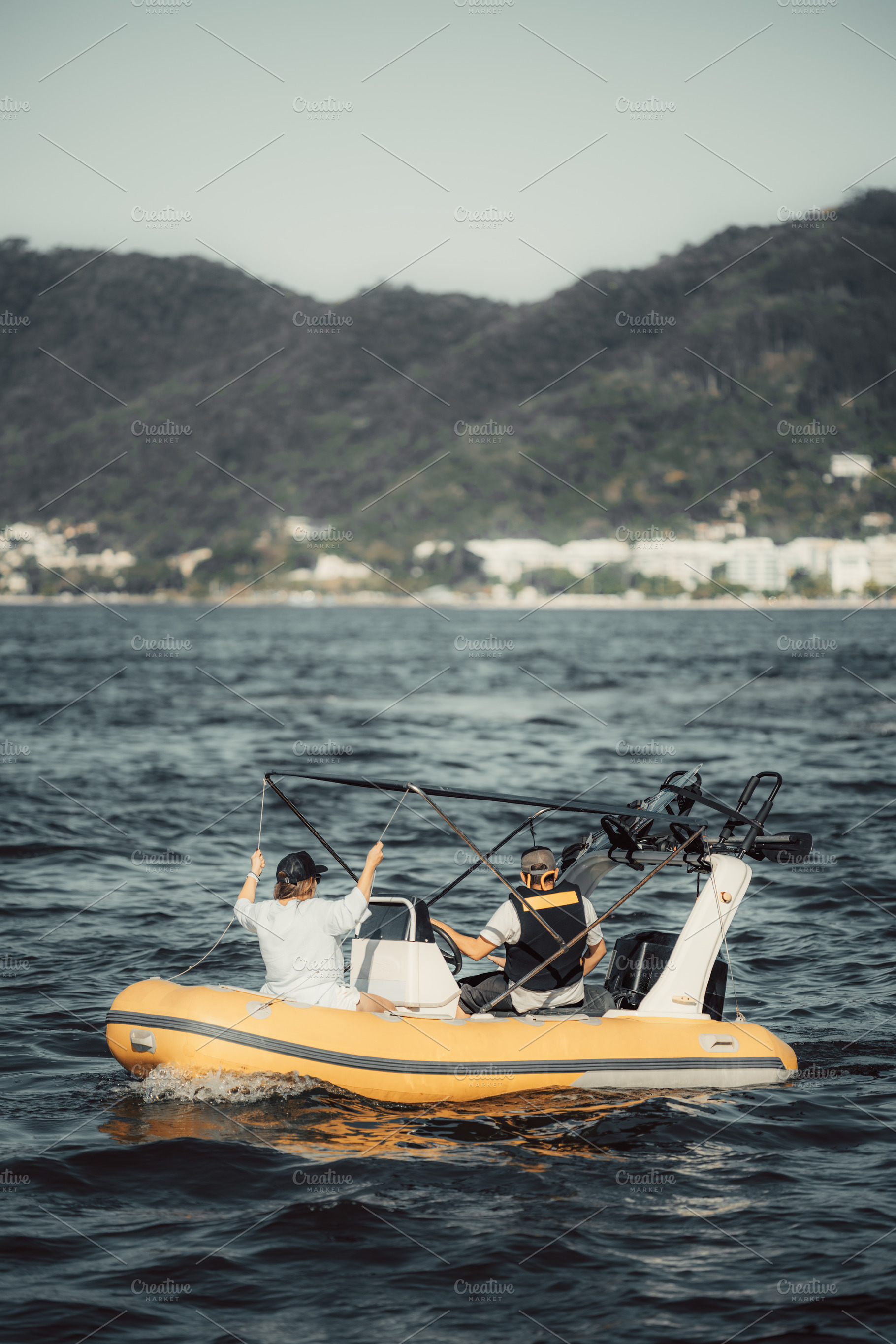 Couple on yellow inflatable boat, a Sports & Recreation Photo by SkyNext