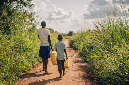 Two Ugandan Kids on Water Walk