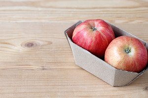 Red apples in cardboard packaging, a Food & Drink Photo by BalaguR