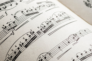 Music notation book containing music, notes, and sheet