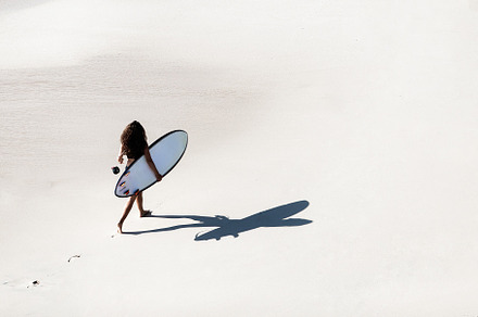 Girl walking along the beach