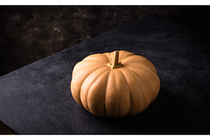 Raw fresh cut pumpkin on dark, a Food & Drink Photo by Yulia Furman