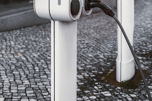 EV charger on stone pavement, a Transportation Photo by SkyNext