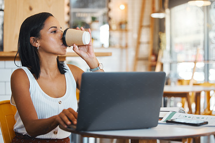 Entrepreneur drinking tea while working on laptop at cafe, woman reading emails online and person enjoying a remote work space at a restaurant. Thinking female browsing the internet at coffee shop, a Photo by Peopleimages.com