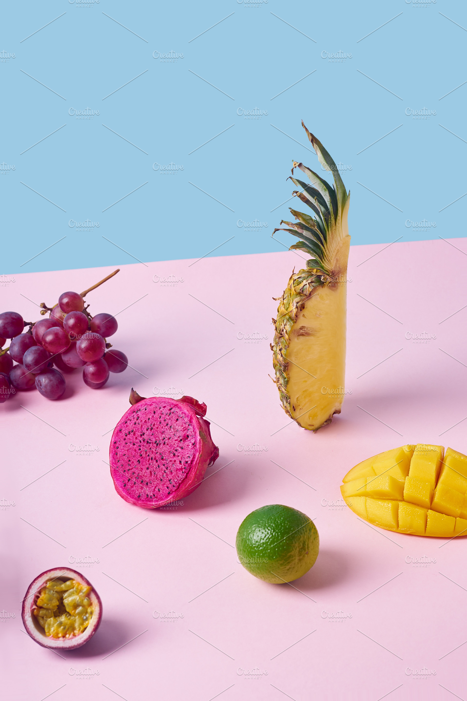 Tropical fruits variety on a colorful background. Side view with, a Food & Drink Photo by Asya Nurullina