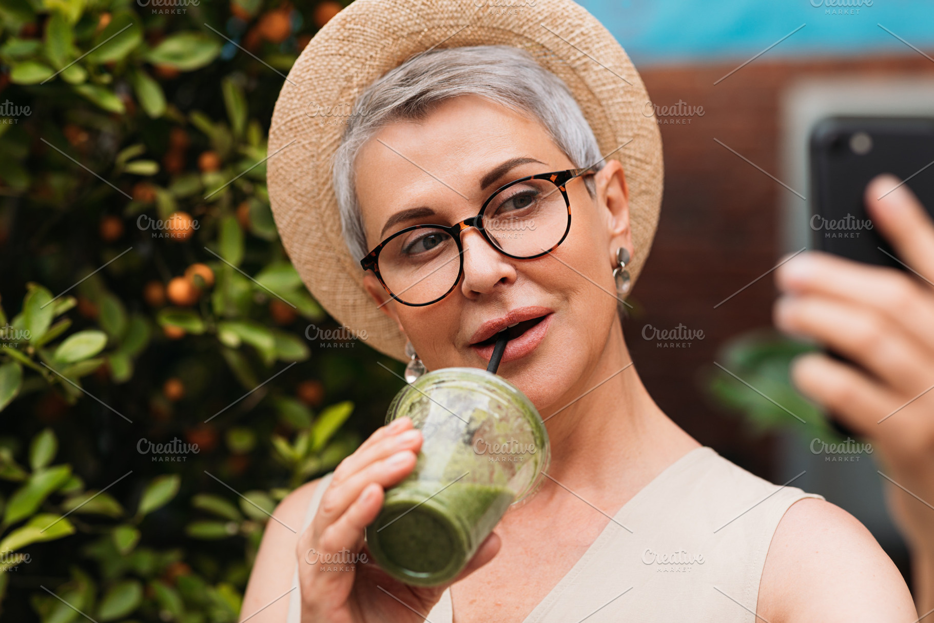 Senior woman taking a selfie outdoor, a Person Photo by Artem Varnitsin