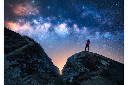 Glowing Milky Way and woman on