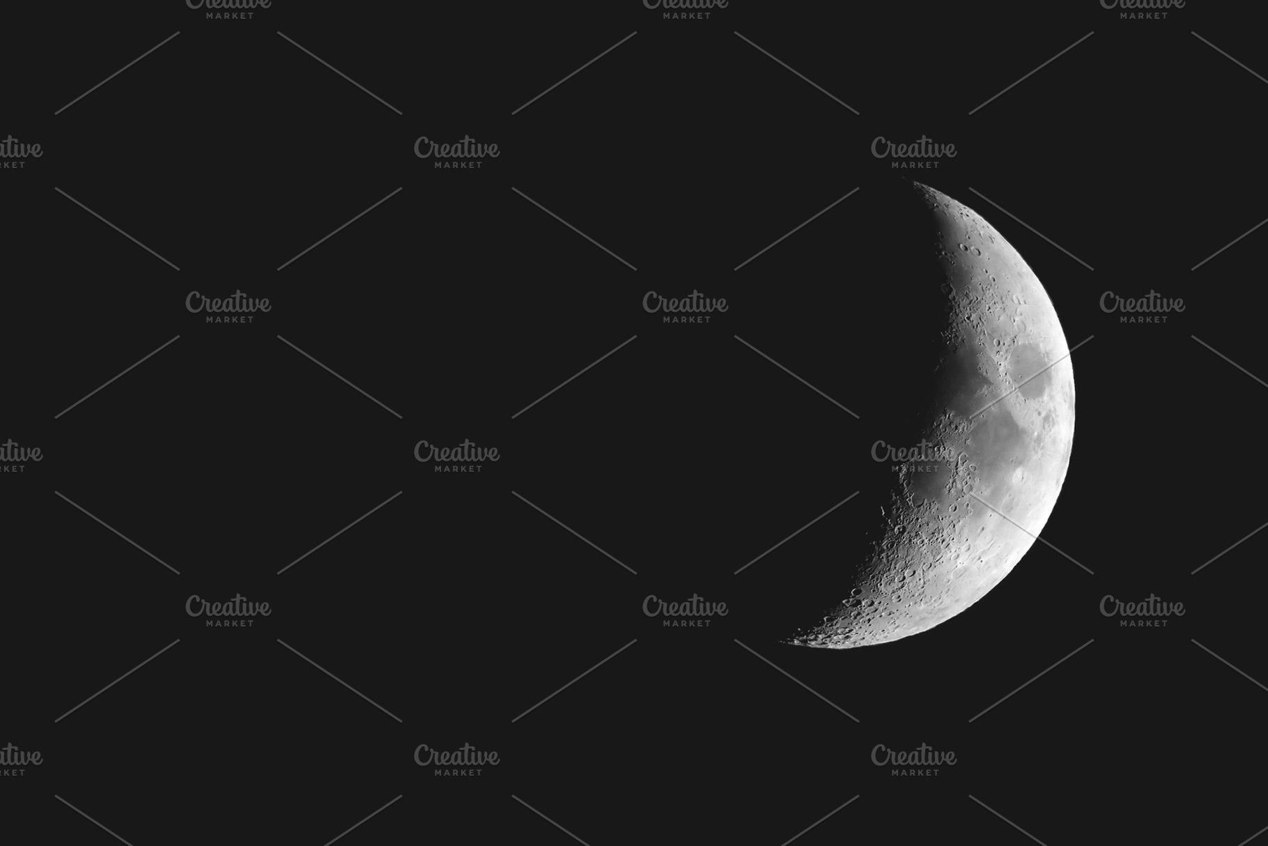 Waxing crescent moon seen with a telescope, a Photo by WorldOfPhotos
