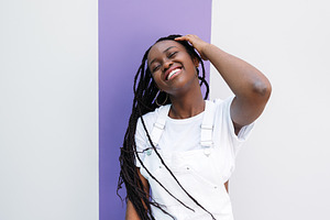 Young woman with braids having fun, a Person Photo by Artem Varnitsin