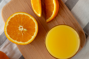Organic Orange Juice in a Glass, top view., a Food & Drink Photo by LiudmylaChuhunova