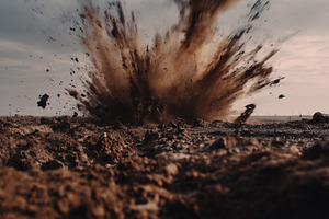 Powerful explosion sends dirt, a Background Photo by MistyDay