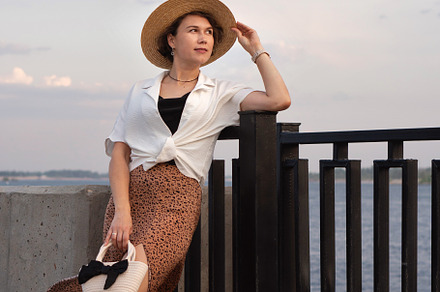 Stylish woman in straw hat