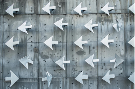 Multiple white arrows pointing the, a Business Photo by Ylivdesign