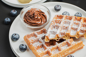 Belgium waffles Homemade waffles with strawberries, a Food & Drink Photo by Budarinphoto