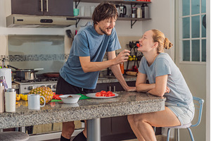 Woman and man preparing breakfast, a Person Photo by Elizaveta Galitskaya