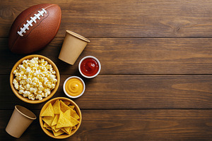 American football on wooden table wi, a Photo by Dvoevnore photos