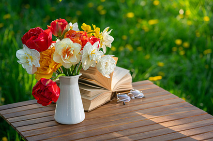 Bouquet of flowers, book on table, an Arts & Entertainment Photo by LanaSweet