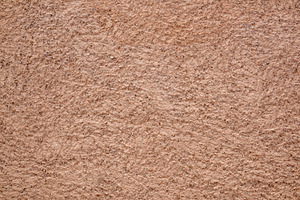 Rough brown painted exterior facade cement wall, a Photo by Davizro's Market