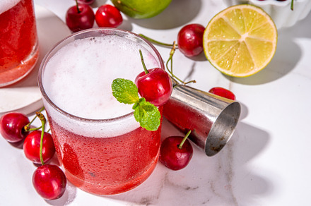 Cherry and lime alcoholic booze cocktail, a Food & Drink Photo by Rimma